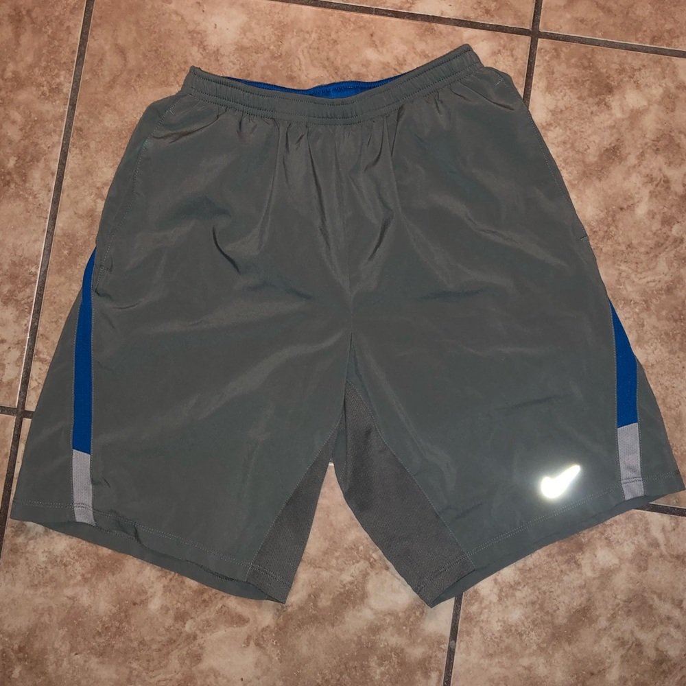 Nike small men’s gray dri-fit running shorts.